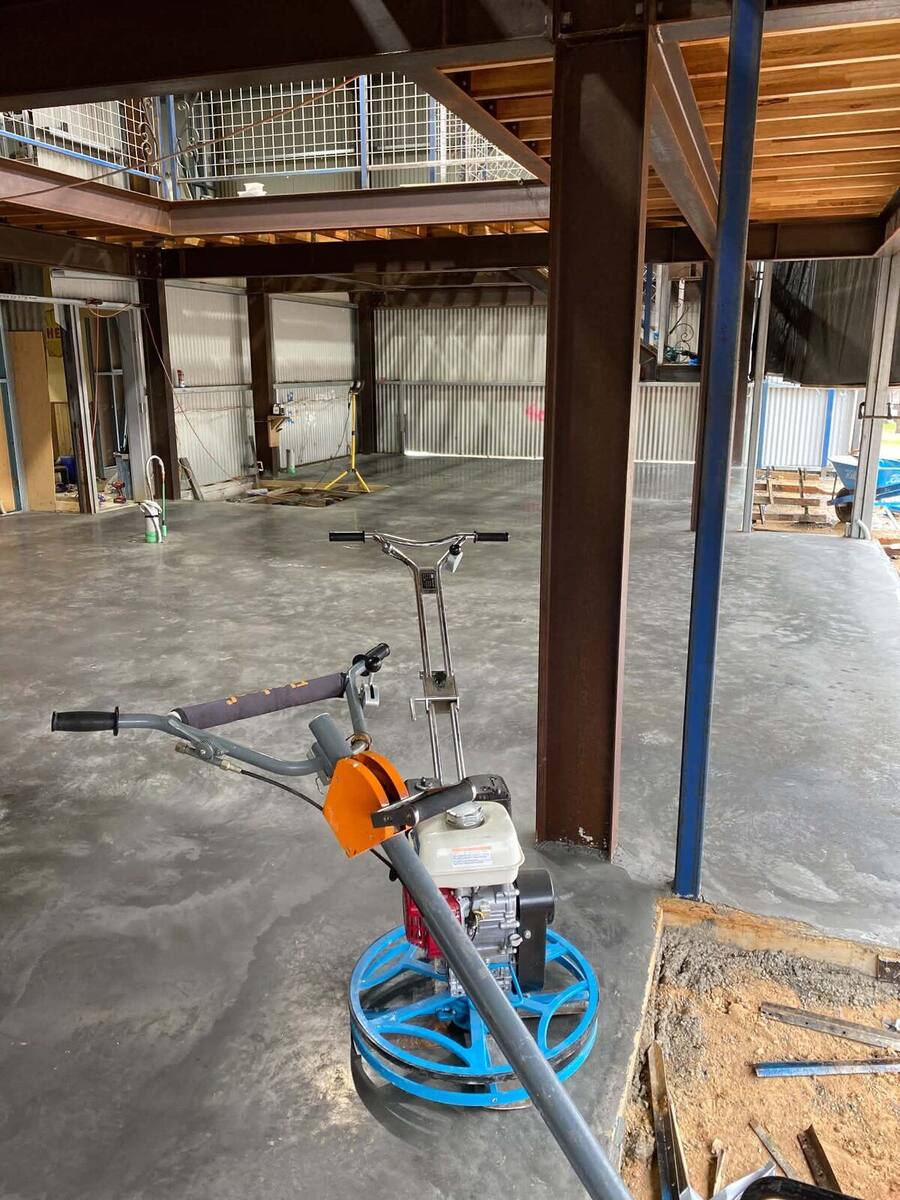 Power trowel on a burnished interior concrete floor